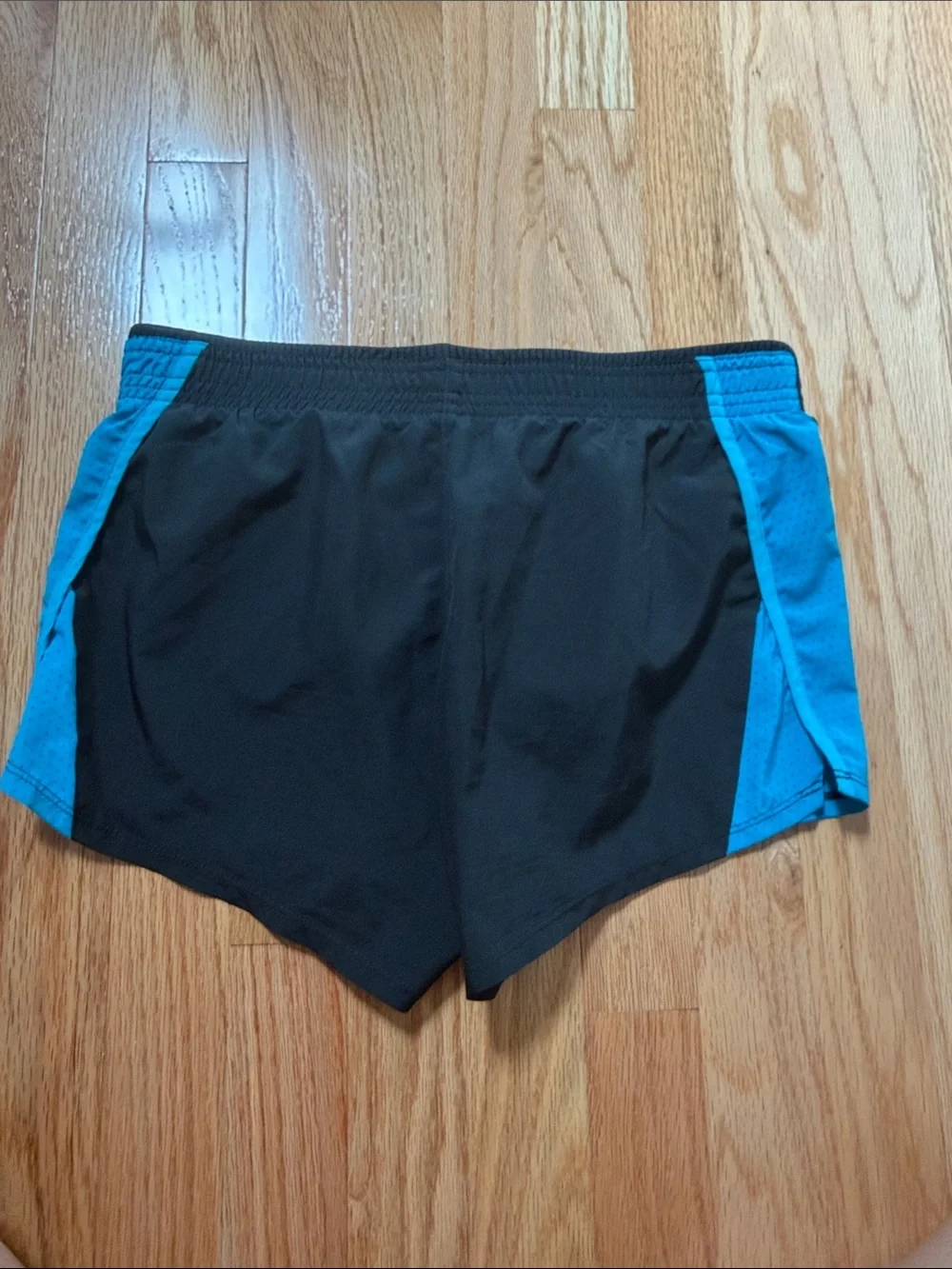 Nike Women's Black Shorts with Blue Side Panels